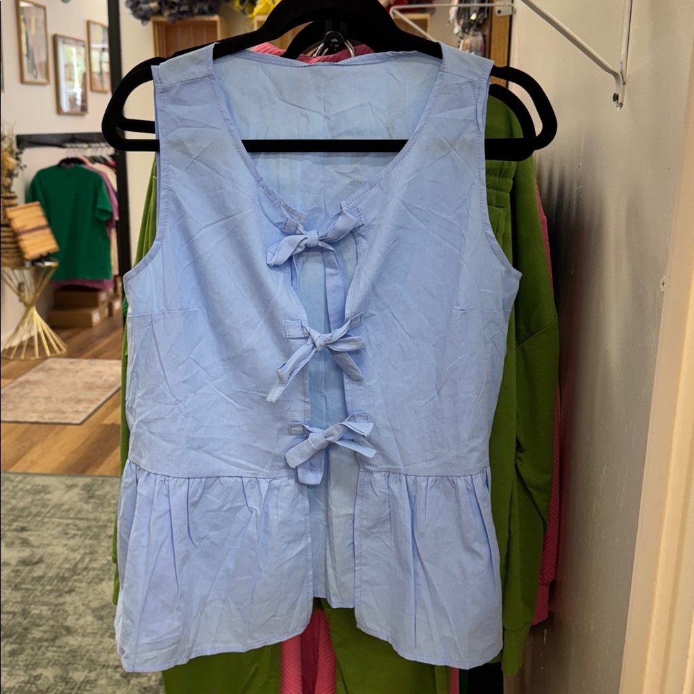 Chic Blue Sleeveless Top with Bow Accents